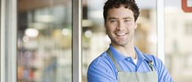 Man standing in front of his store